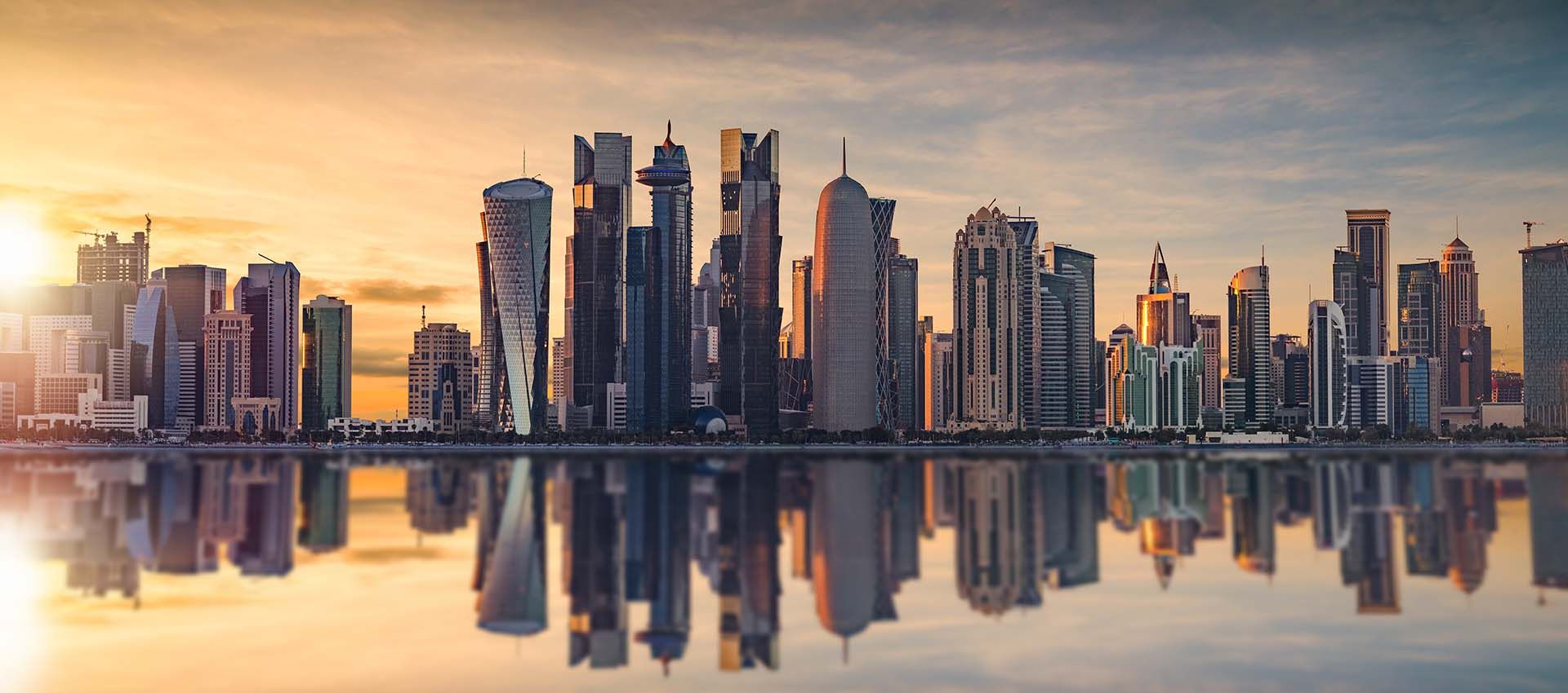 Doha skyline reflected in the water of West Bay